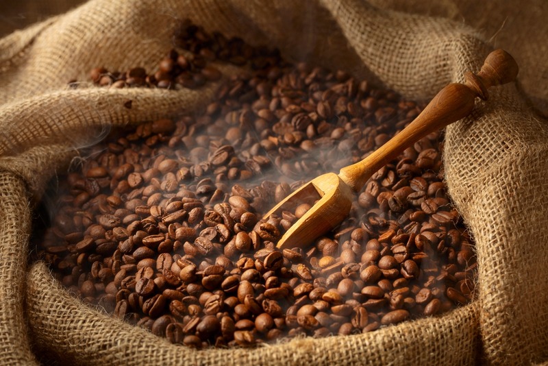 Fresh,Roasted,Coffee,Beans,And,Wooden,Scoop,In,Burlap,Bag.